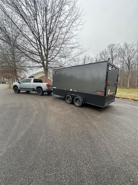 Enclosed trailer rental being towed in London Kentucky - Rent-It Daily professional trailer rentals